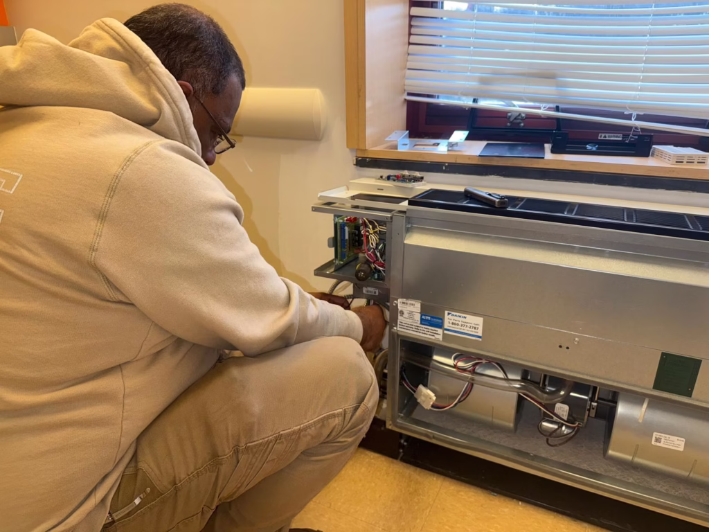 plumber in forest hills is diagnosing the issue why there is no heat