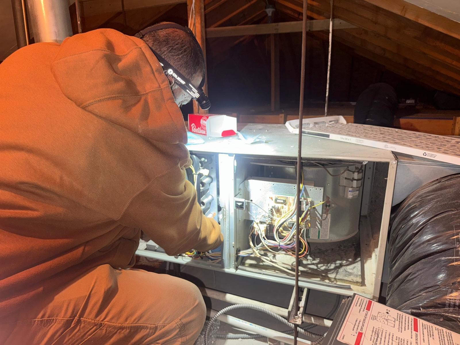 Plumber is working on Furnace in Forest Hill NY